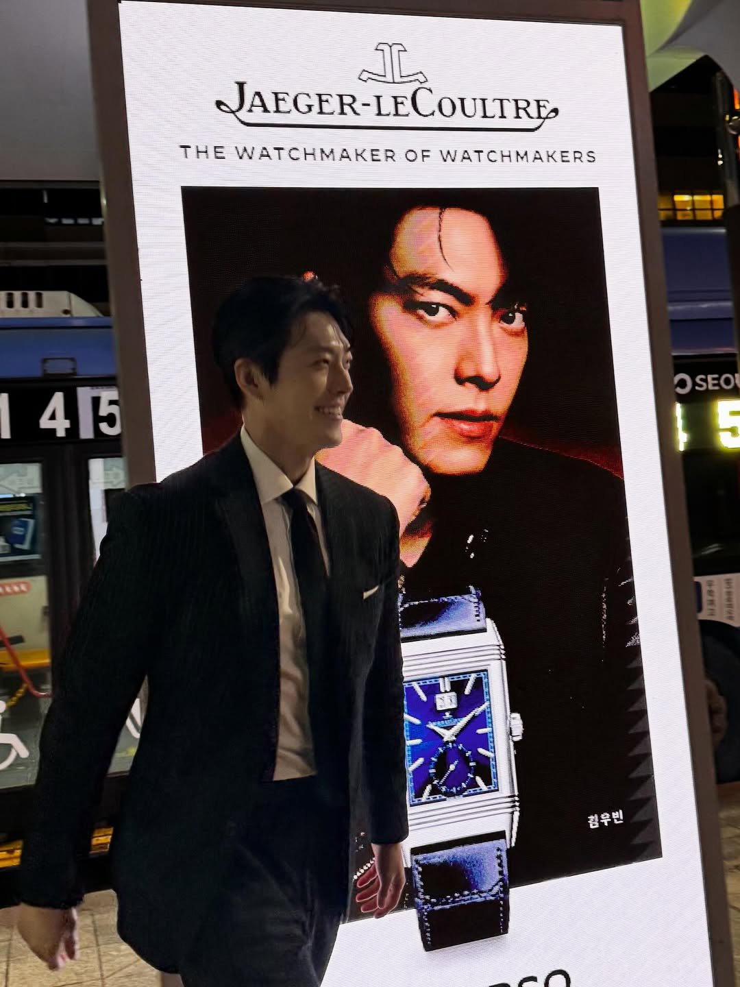 Photo shared by 김우빈 on December 14, 2025 tagging @jaegerlecoultre. May be an image of suit, lego, poster and dinner jacket.