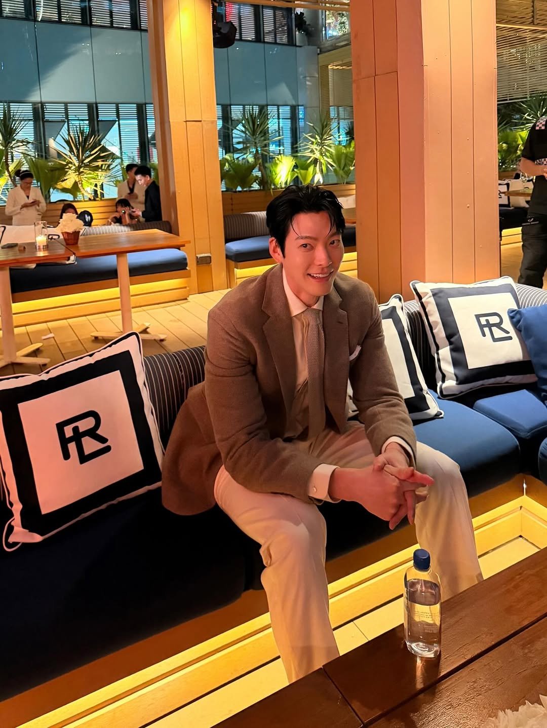 Photo by 김우빈 on November 29, 2025. May be an image of deck chair, suit and blazer.