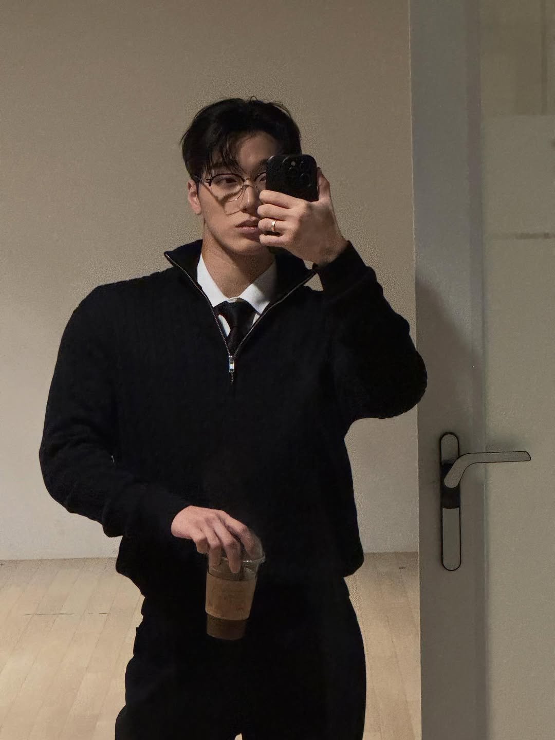 Photo by 산 (SAN) on December 24, 2025. May be a selfie of duffle coat, wingtip shoes, turtleneck, bolo tie, mirror and text.