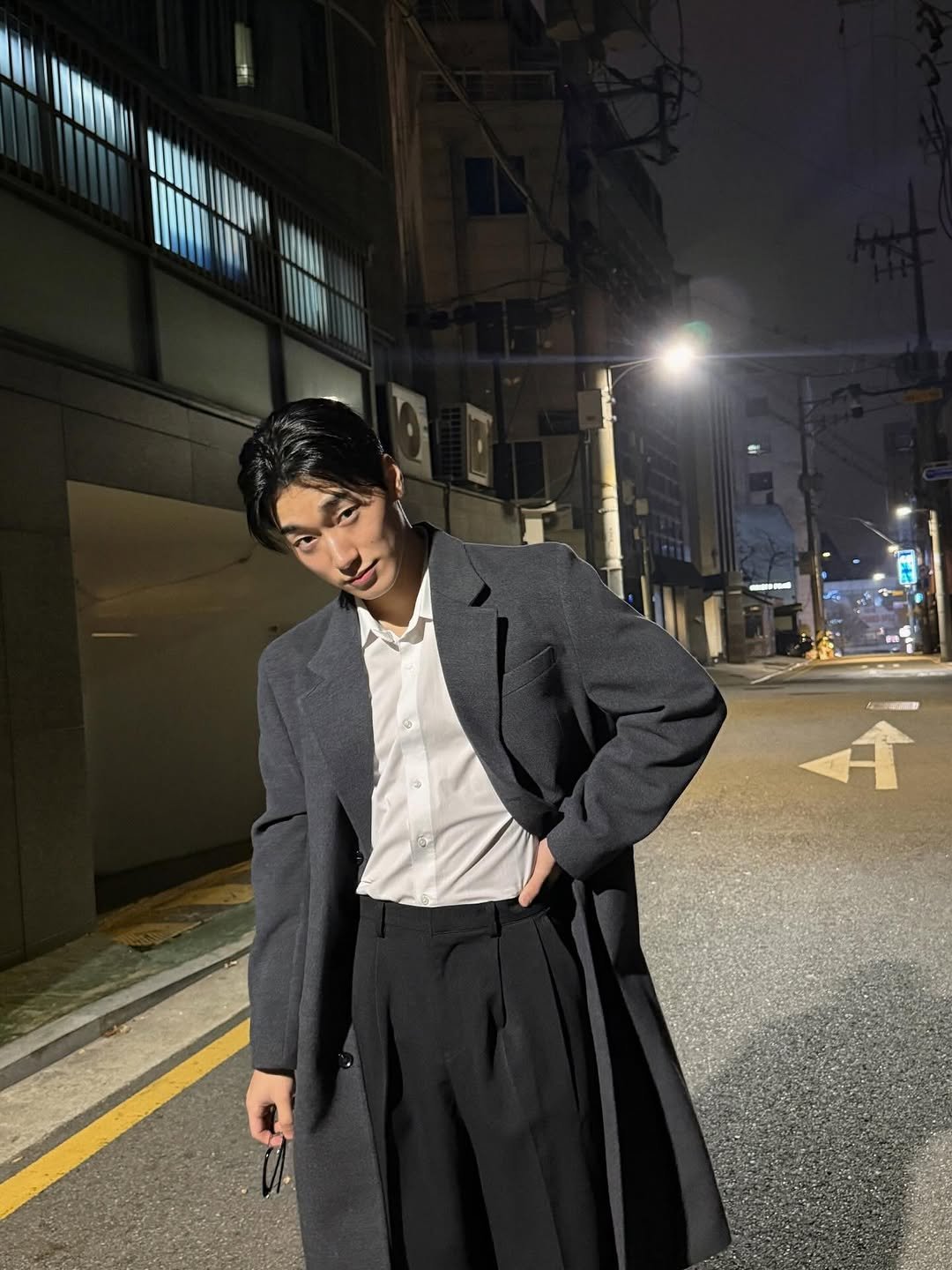 Photo by 산 (SAN) on December 01, 2025. May be an image of duffle coat, overcoat, blazer, suit and text that says '- 介'.