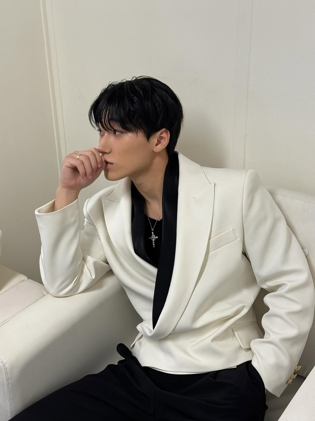 Photo by 산 (SAN) on November 22, 2025. May be an image of blazer, bolo tie and text.