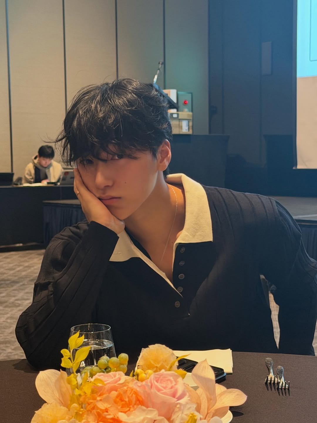 Photo by 산 (SAN) on January 07, 2026. May be an image of one or more people, hair, bolo tie and text.