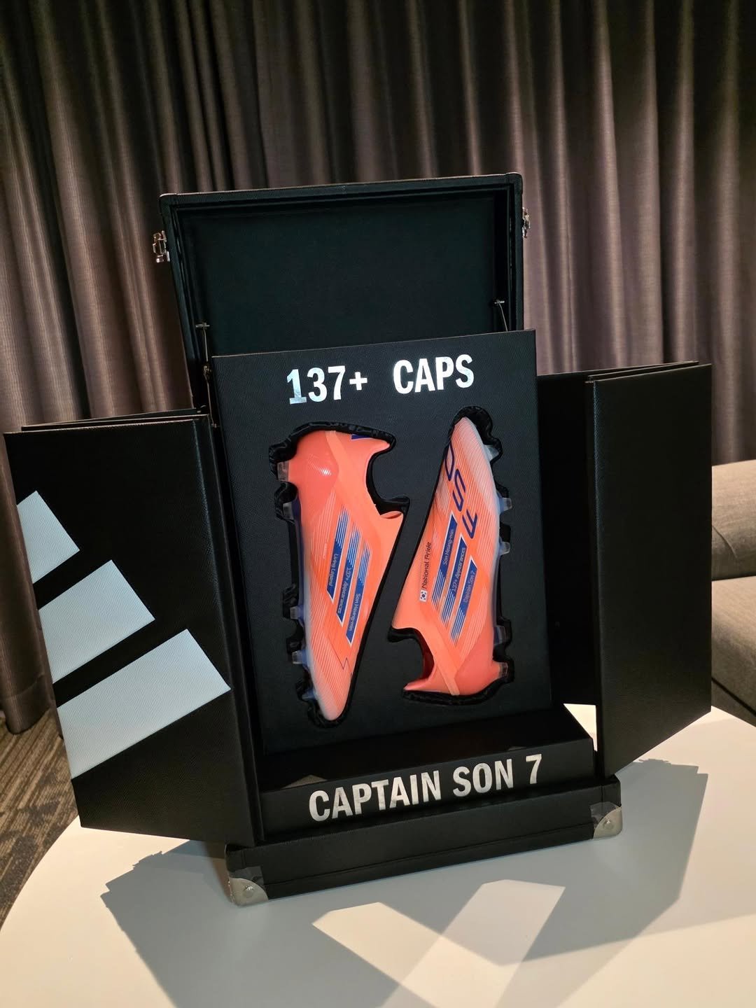 Photo shared by Son HeungMin(손흥민)🇰🇷 on November 16, 2025 tagging @adidasfootball, and @adidaskr. May be an image of Superman, toecap shoes and text that says '137+CAPS 137+ CAPS CAPTAIN SON 7'.