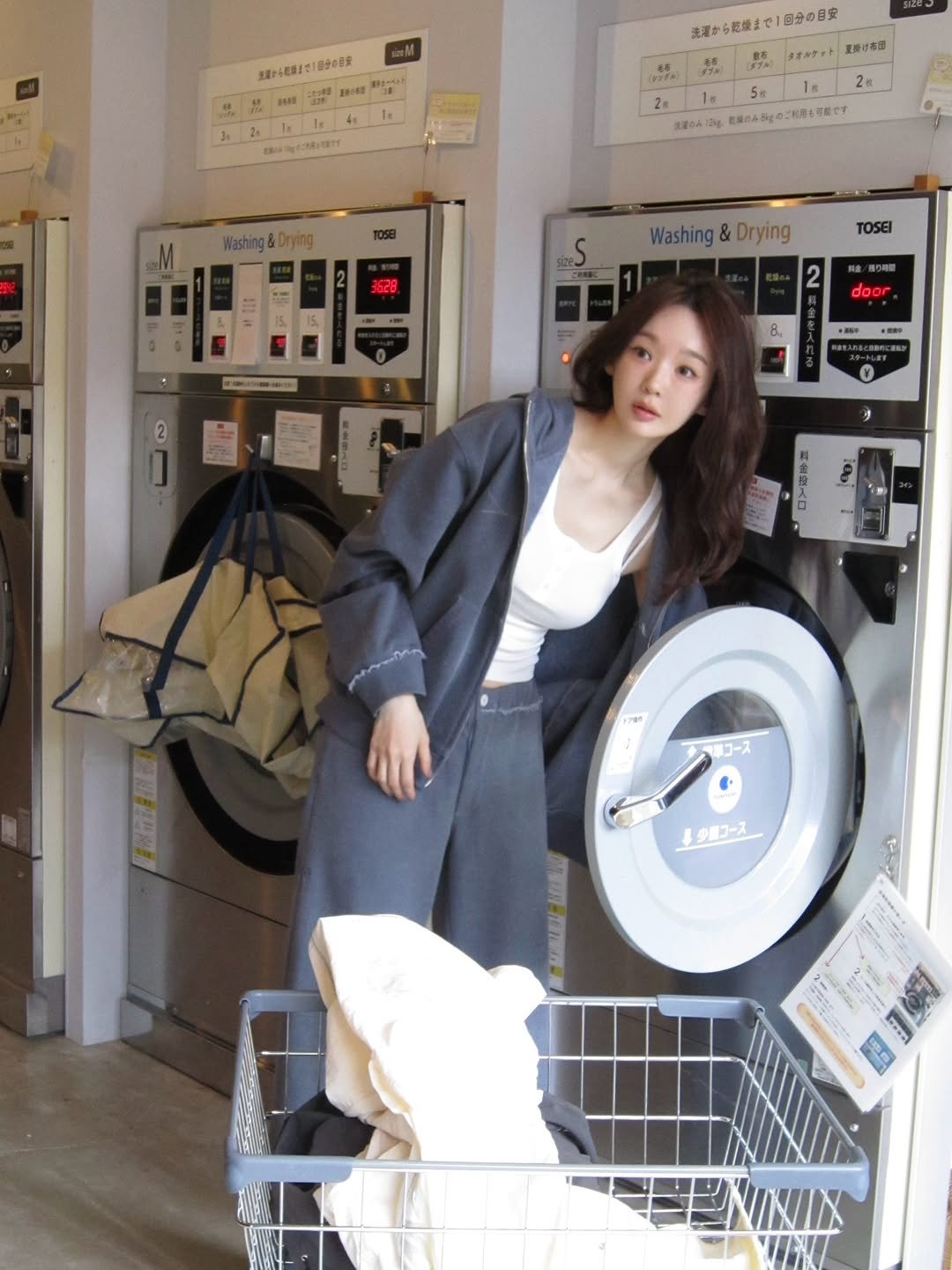 Photo shared by 강민경 (행동파) on November 16, 2025 tagging @aviemuah. May be an image of clothes hanger, laundromat and text.