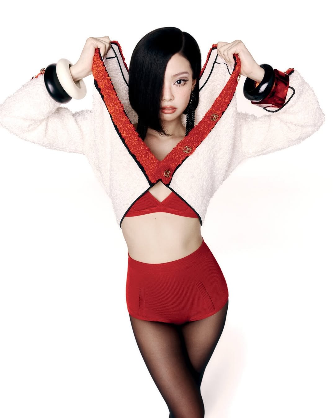 Photo shared by Enida rufati ♡ on December 31, 2025 tagging @vmagazine, @mar_______vin, and @jennierubyjane. May be an image of one or more people, makeup, knit, turtleneck, fishnet stockings, miniskirt, sweater, tights and text.