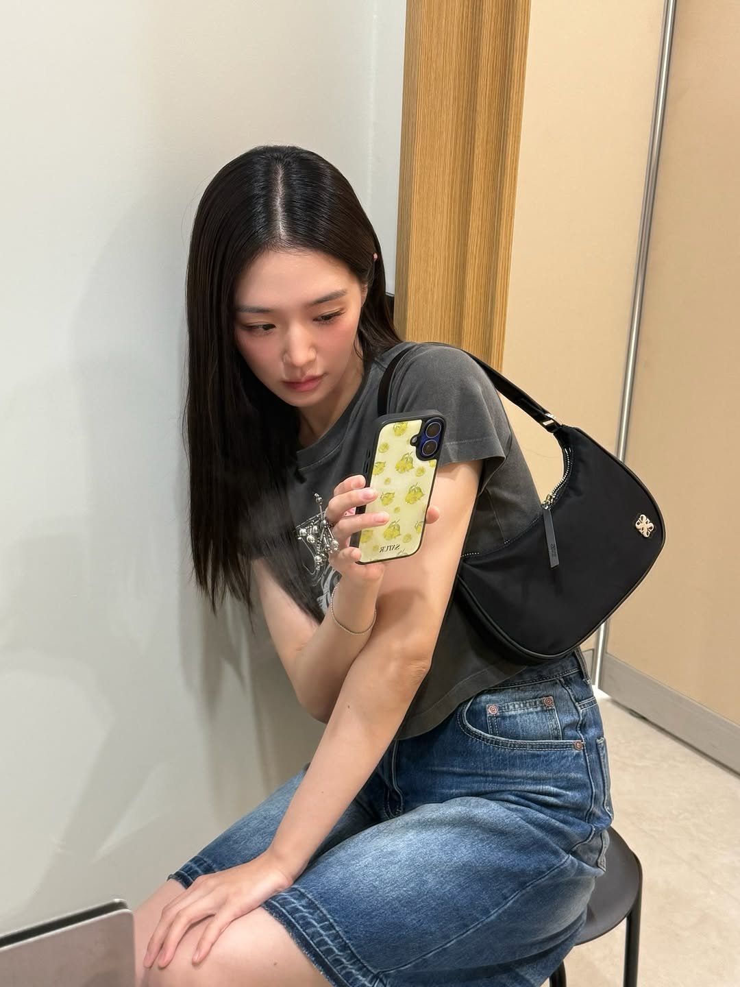 Photo shared by 박규영 on July 09, 2025 tagging @satur_official. May be an image of 1 person, hair, phone, purse, sling and text that says '黑'.
