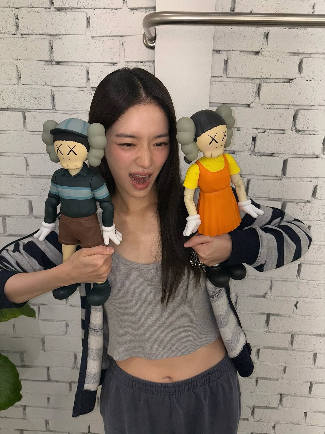 Photo shared by 박규영 on July 10, 2025 tagging @kaws, and @squidgamenetflix. May be a cartoon of 1 person, lego and text.