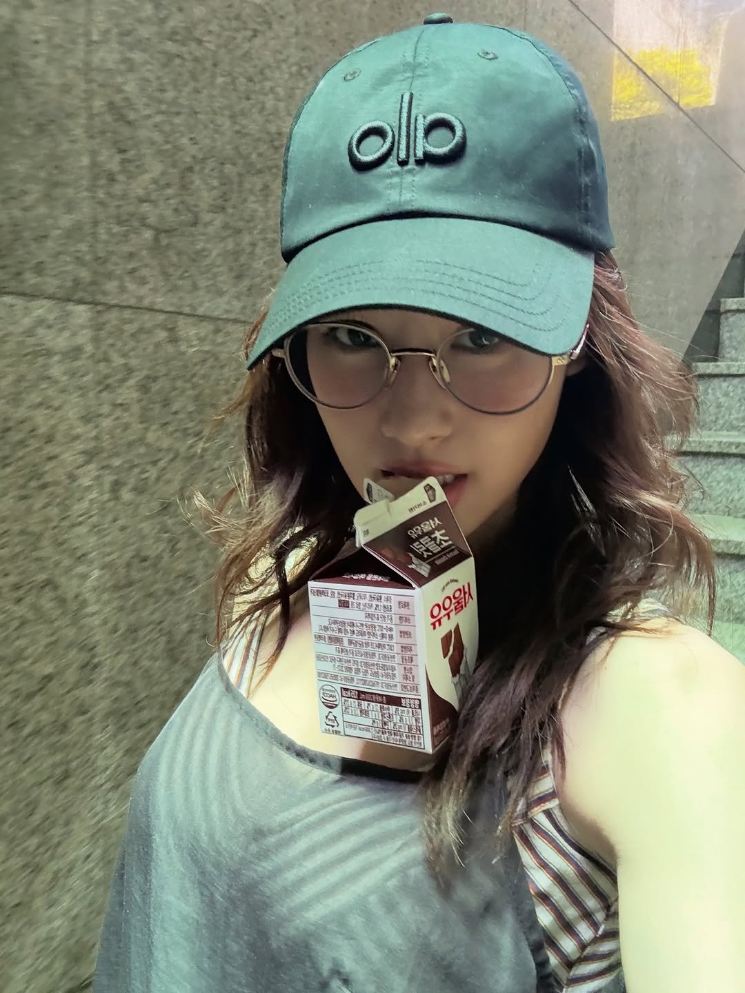 Photo shared by 사나 𝚂𝚊𝚗𝚊 on January 05, 2026 tagging @alo. May be an image of hat, milk, cornflower and text.