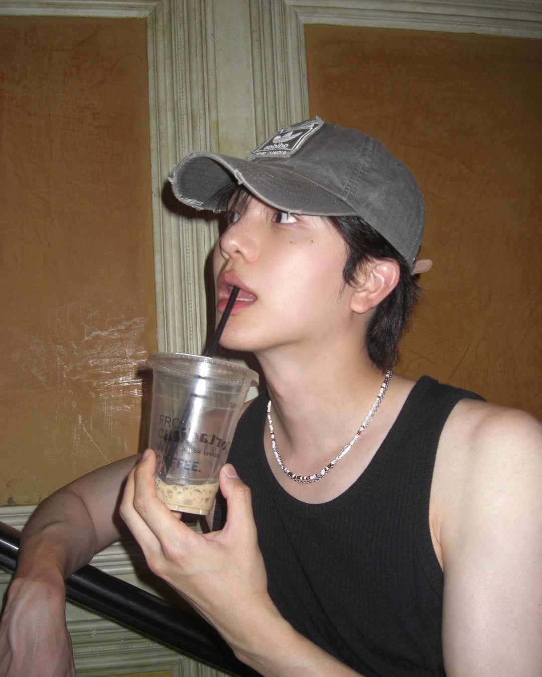 Photo by 사선웅 on July 25, 2025. May be an image of 1 person, cigarette, bolo tie and text.