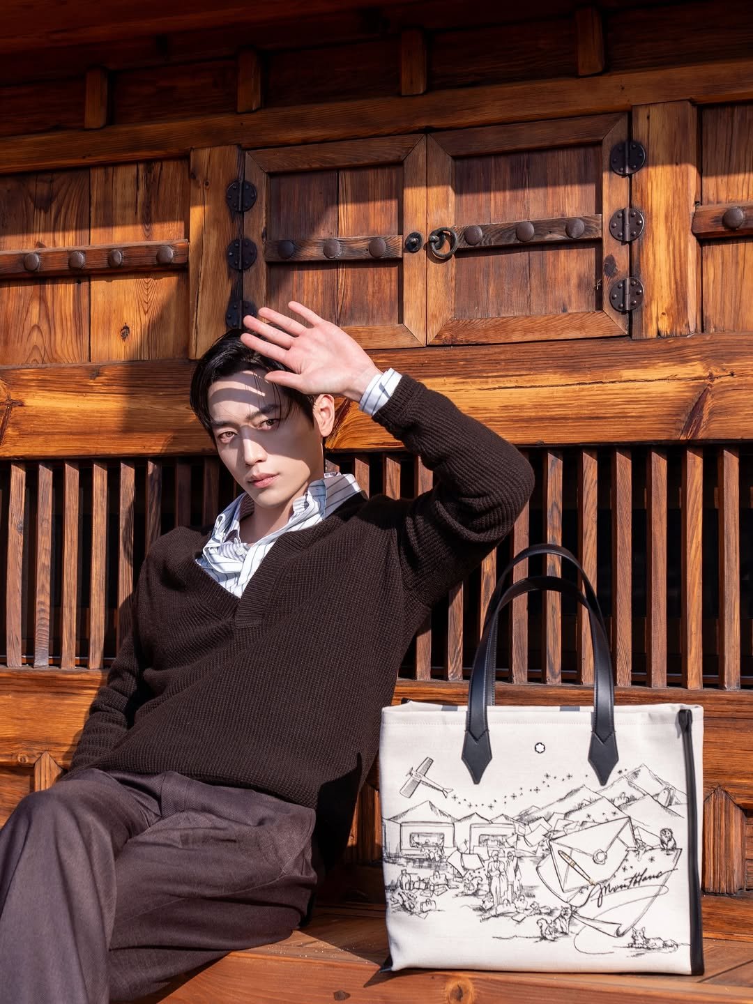 Photo shared by 서강준 on December 07, 2025 tagging @montblanc. May be an image of leather, purse and briefcase.