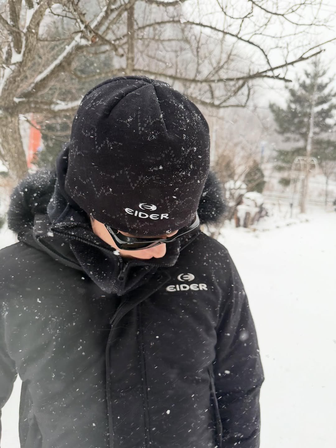 Photo shared by 남주혁 on January 13, 2026 tagging @eider.official. May be an image of snowball, hat, goosedown coat, face mask, fleece, snowsuit, parka, ski slope, snow and text.