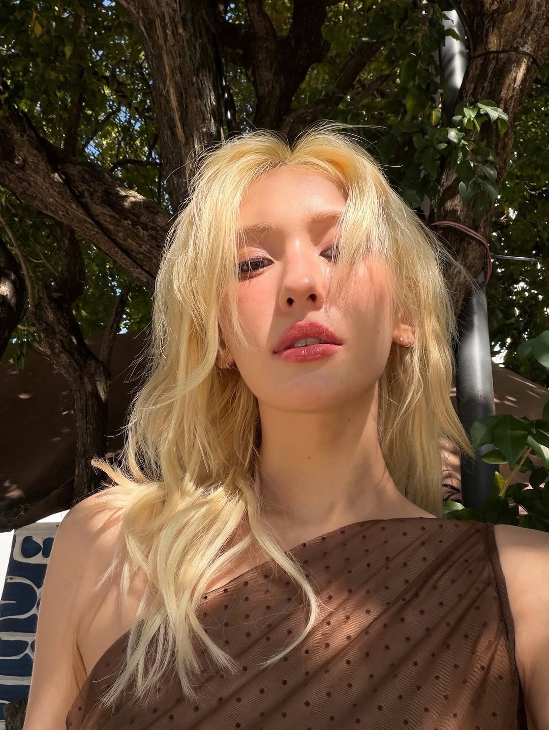 Photo by SOMI on December 09, 2025. May be an image of one or more people, blonde hair and makeup.