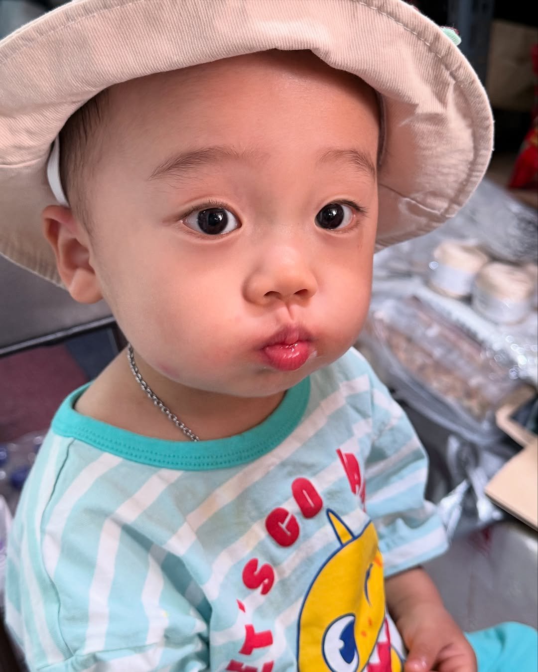 Photo by 양지영 (토빵이네🐰) on June 11, 2025. May be a closeup of 1 person, baby, hat and text.