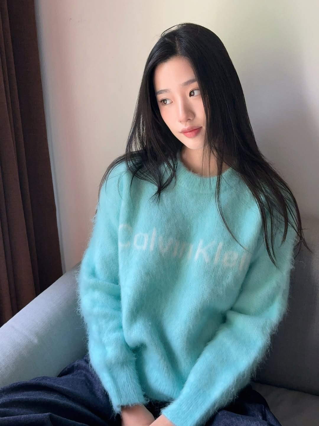 Photo shared by ตู / t u on November 27, 2025 tagging @calvinklein. May be an image of one or more people, hair, sweater, top, turtleneck, knit and text.