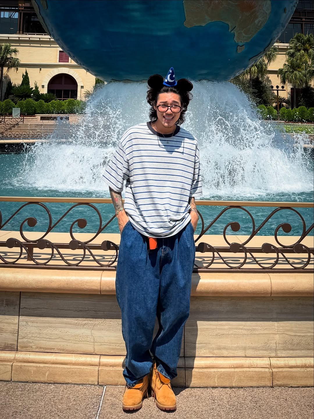 Photo shared by 비 르 on July 27, 2025 tagging @virstyle.kr. May be an image of 1 person, globe, fountain and text.