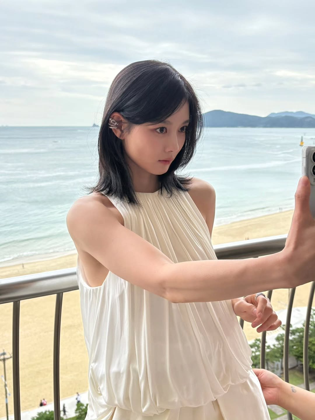 Photo by 김유정  KIM YOU JUNG 🇰🇷 on September 22, 2025. May be an image of one or more people, hair, sleepwear, sundress, dress and text.